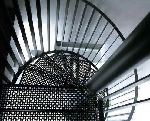 black and white image of a perforated steel step spiral stair