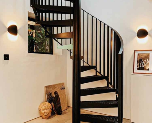 black steel spiral stair with vertical spindles