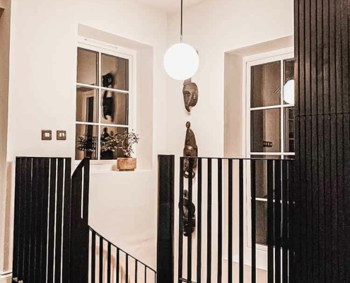 top platform of a steel spiral staircase with perforated steps