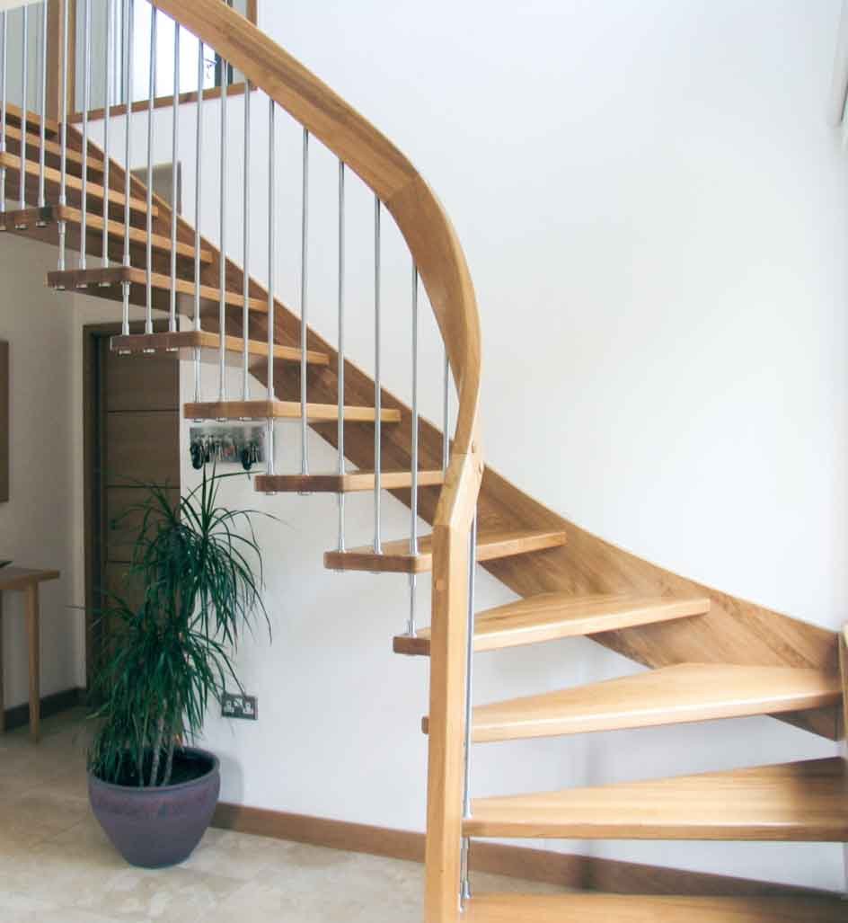curved handrail on an open riser staircase