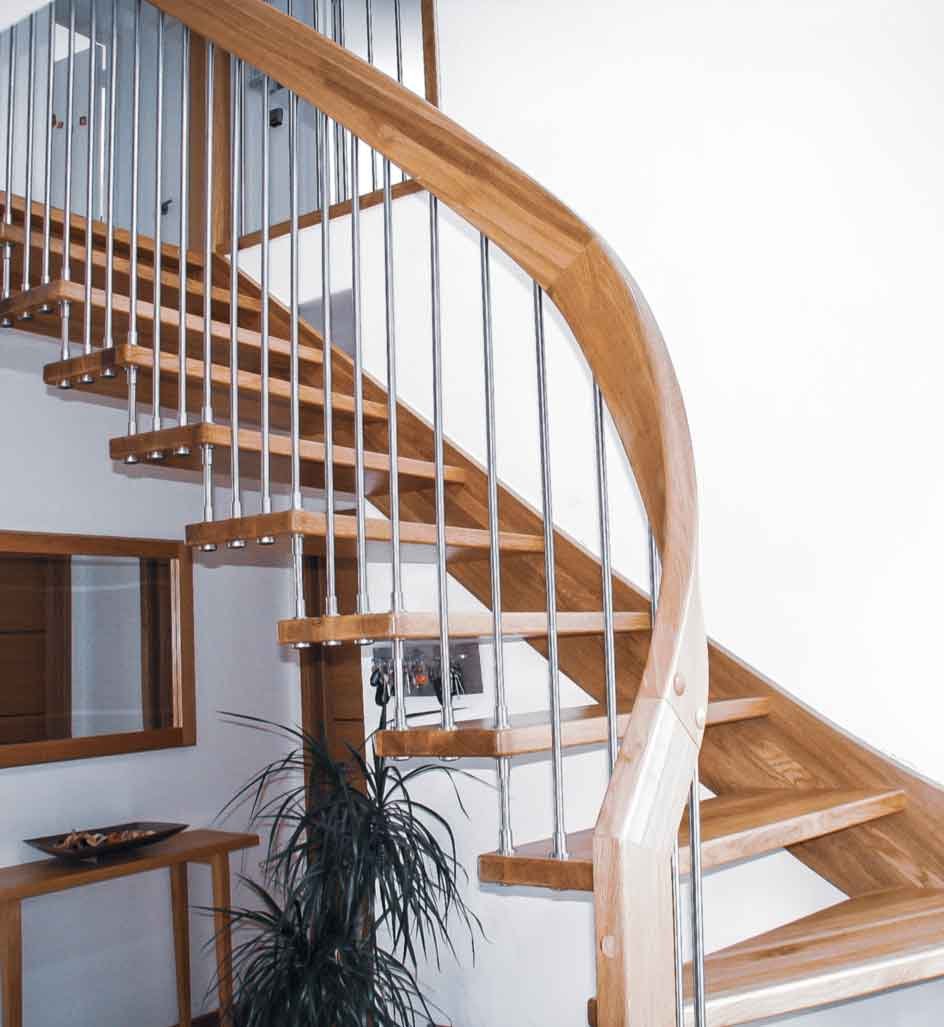 twisting curving oak handrail on an oak stair