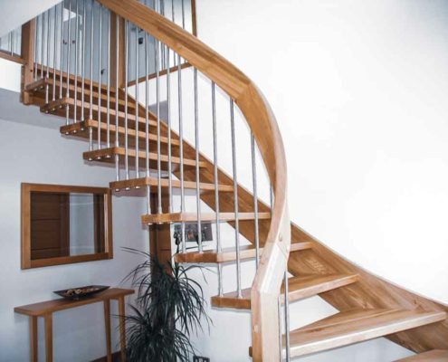 curved handrail on an open staircase