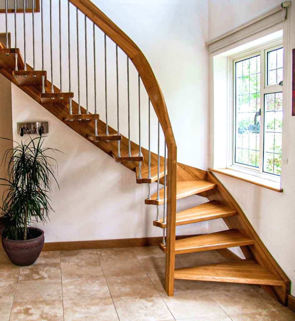 window next to an open riser oak staircase
