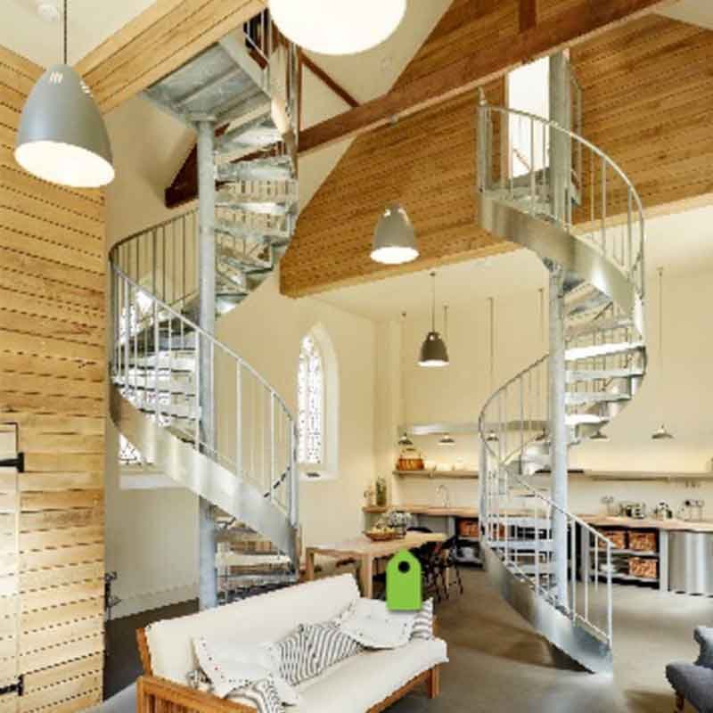 two steep spiral staircases in a domestic setting