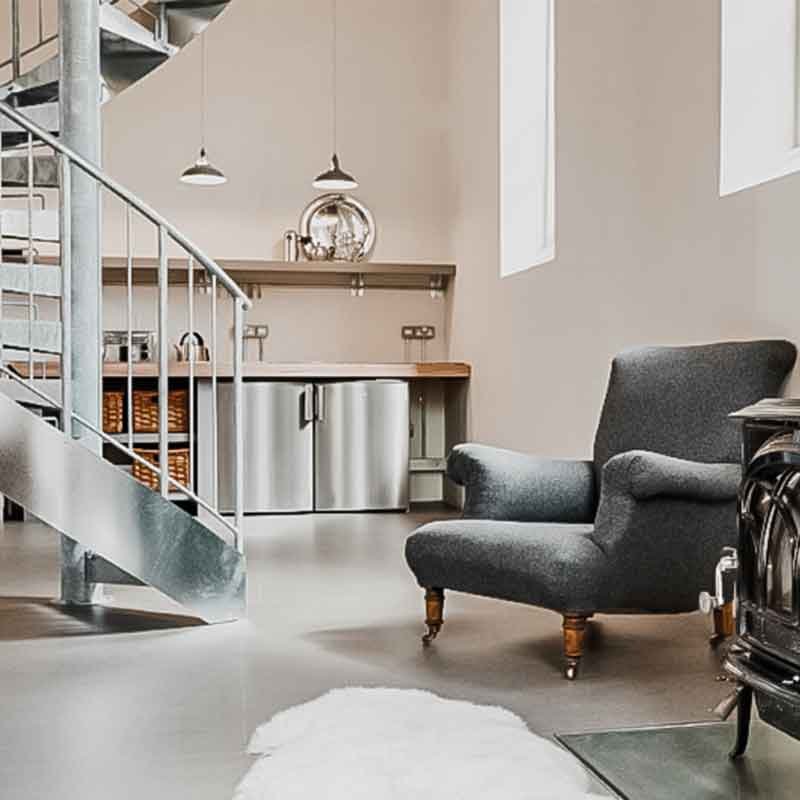 concrete floor with easy chair and steel spiral