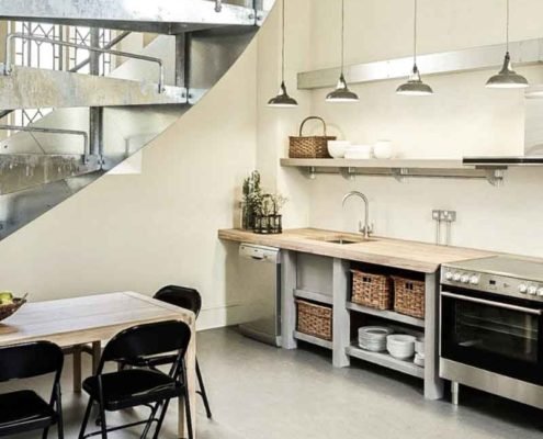 modern kitchen and wooden table and steel spiral stair