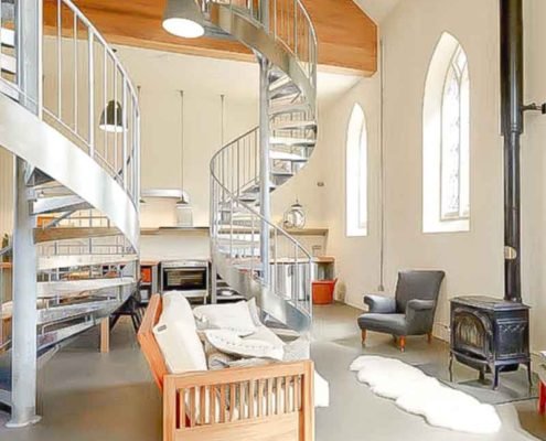 two steel spiral stairs in chapel conversion