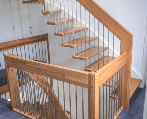 landing balustrade around stairwell and floating stair in oak