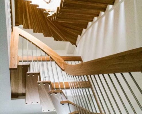 underside of oak staircase with open risers