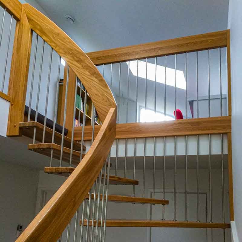 through view of a floating stair with oak steps in a house