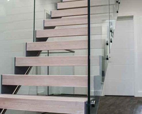 grey steel stair with glass panels