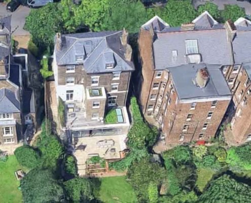 aerial view of rear of large townhouse