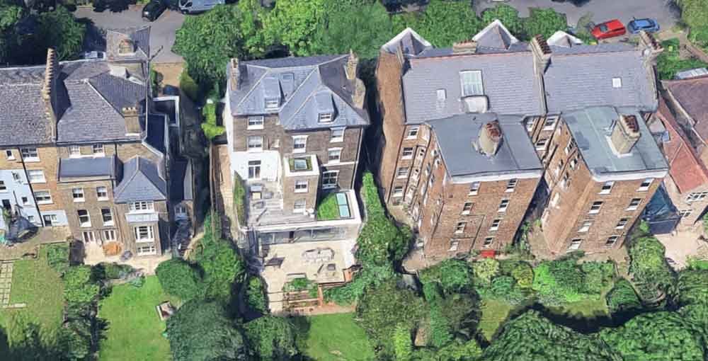 aerial view of rear of large townhouse