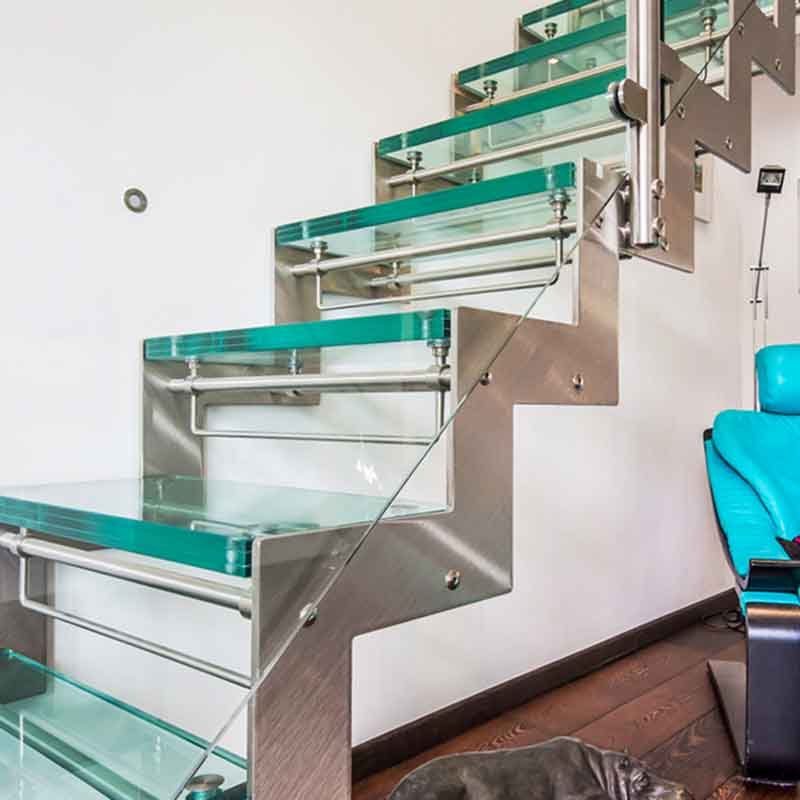 stainless steel stringers on a glass staircase