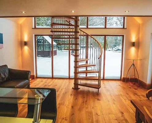 Chard-Spiral-Staircase with a large window behind