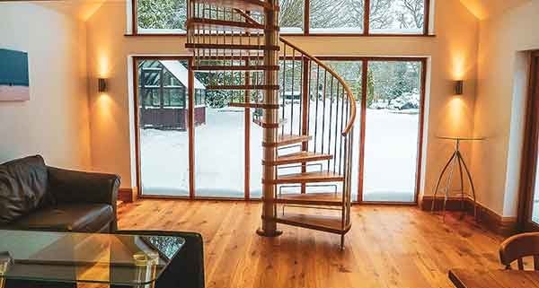 Chard-Spiral-Staircase with a large window behind