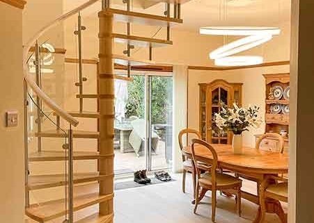 Musselburgh spiral stair with dining table in background