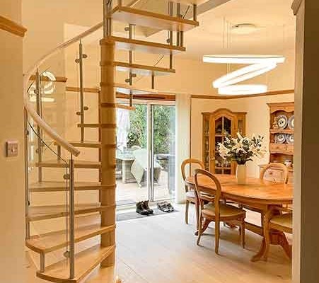Musselburgh spiral stair with dining table in background