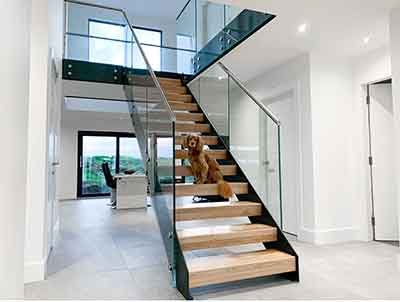 Perth-s Free standing model 500 stair with glass balustrade and oak treads and open risers