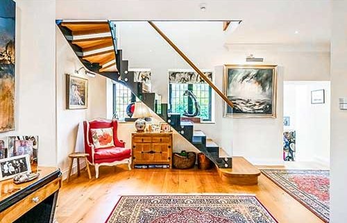 sleek quarter turn steel and glass staircase with oak treads