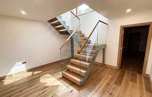 half turn steel and glass stair and oak treads