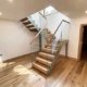half turn steel and glass stair and oak treads