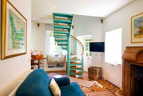 Light-green-steel-and-wood-spiral-in-a-living-area