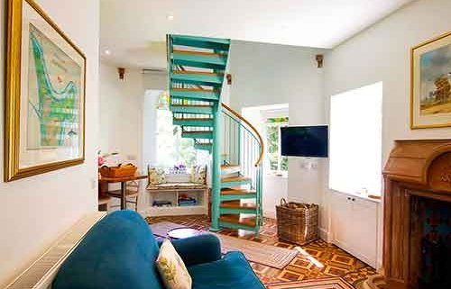 Light-green-steel-and-wood-spiral-in-a-living-area