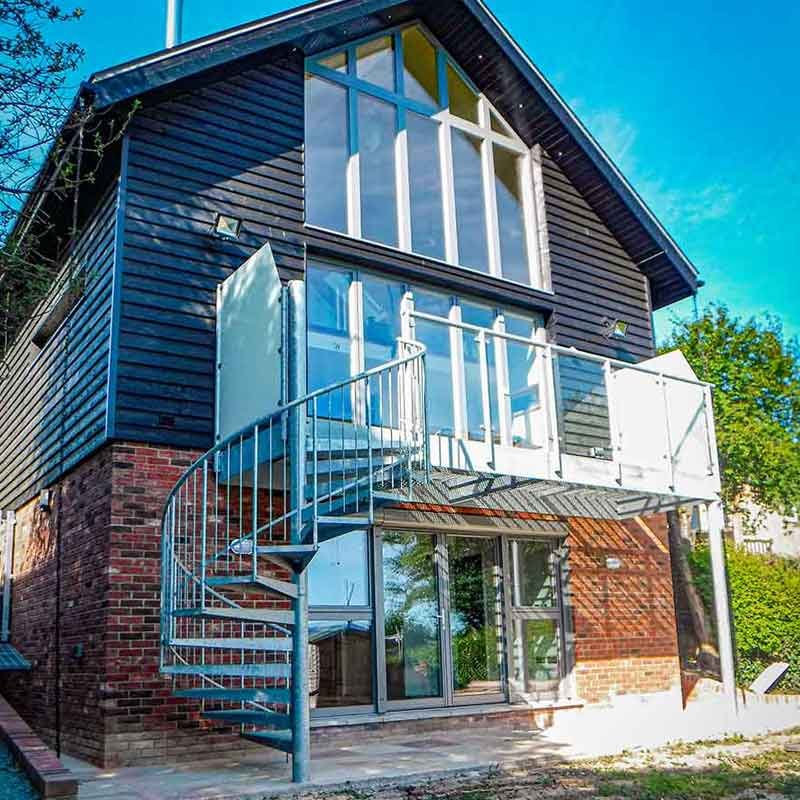 Spiral-Staircase-Maldon-essex-leading-up-to-balcony External spiral staircase leading to an outdoor balcony at a new build home in Maldon