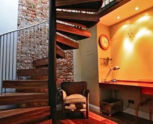 Walnut-and-black-steel-spiral-staircase-in-a-Chiswick-home