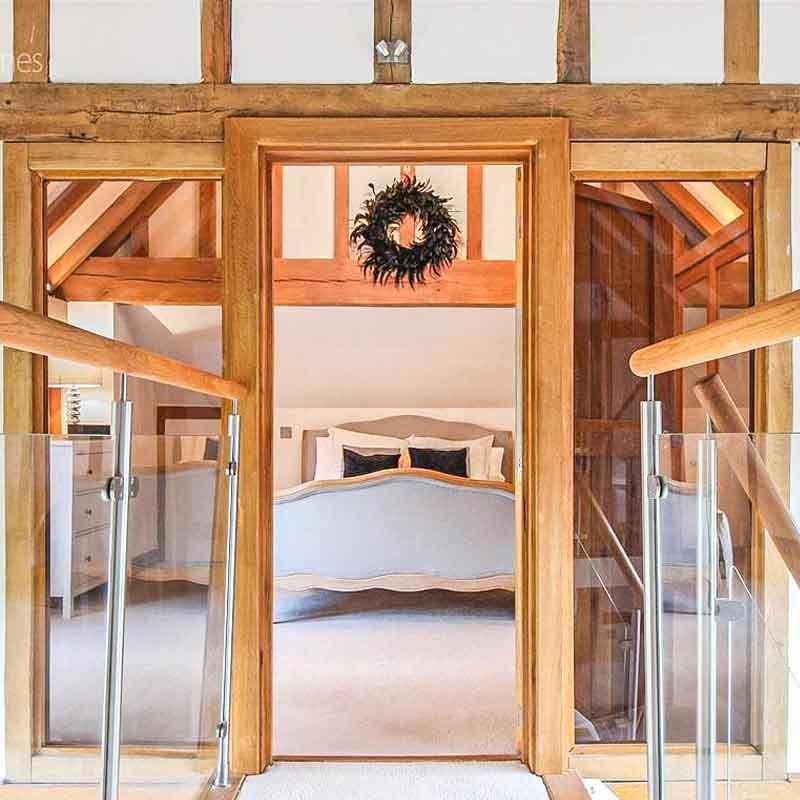 Glass-Staircase-Haywards-Heath-glass-balustrade-and-internal-oak-framework