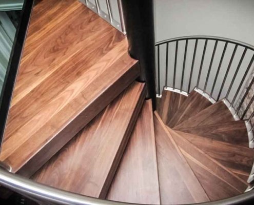 Walnut-spiral-stair-Chiswick-with-a-glass-platform
