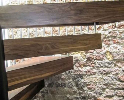 Walnut-spiral-stair-Chiswick-with-thick-timber-steps