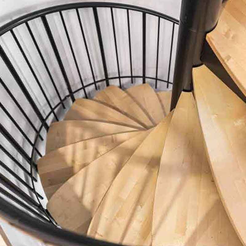 Looking-down-on-the-petal-shaped-maple-steps-of-a-spiral-staircase