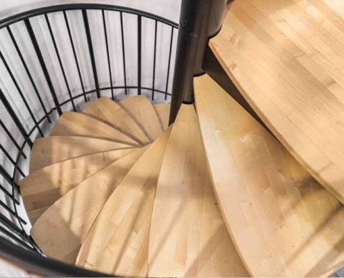 Looking-down-on-the-petal-shaped-wooden-steps-of-a-spiral-staircase
