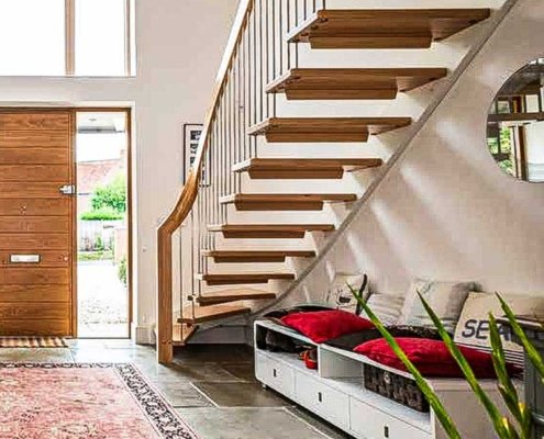 Floating-open-staircase-running-down-a-wall-in-a-large-walkway