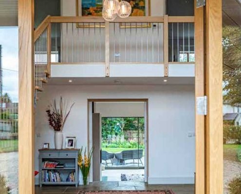 View-through-front-door-of-house-to-hall-kitchen-garden-beyond