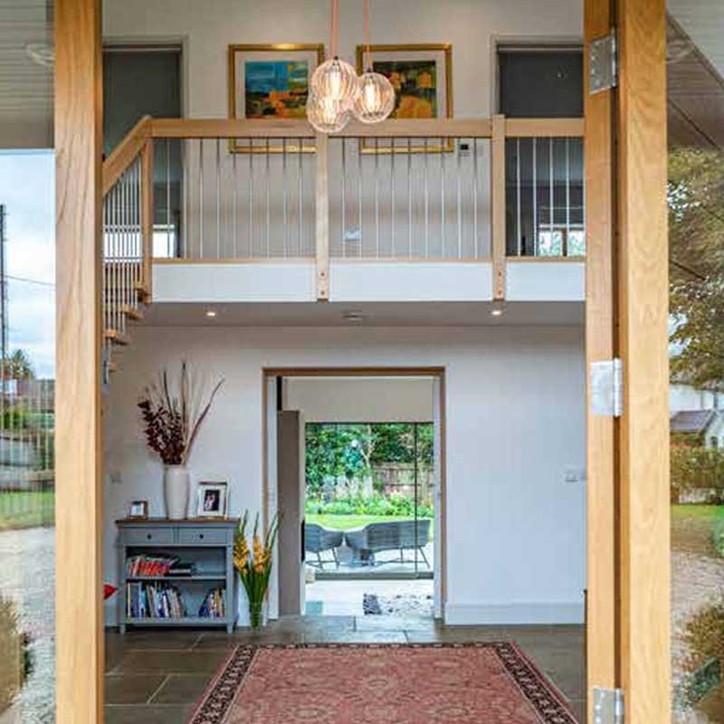 View-through-front-door-of-house-to-hall-kitchen-garden-beyond