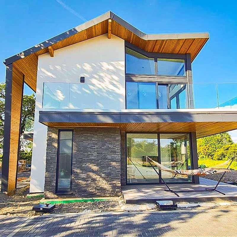 Glass-balcony-wrapping-around-outside-of-new-house