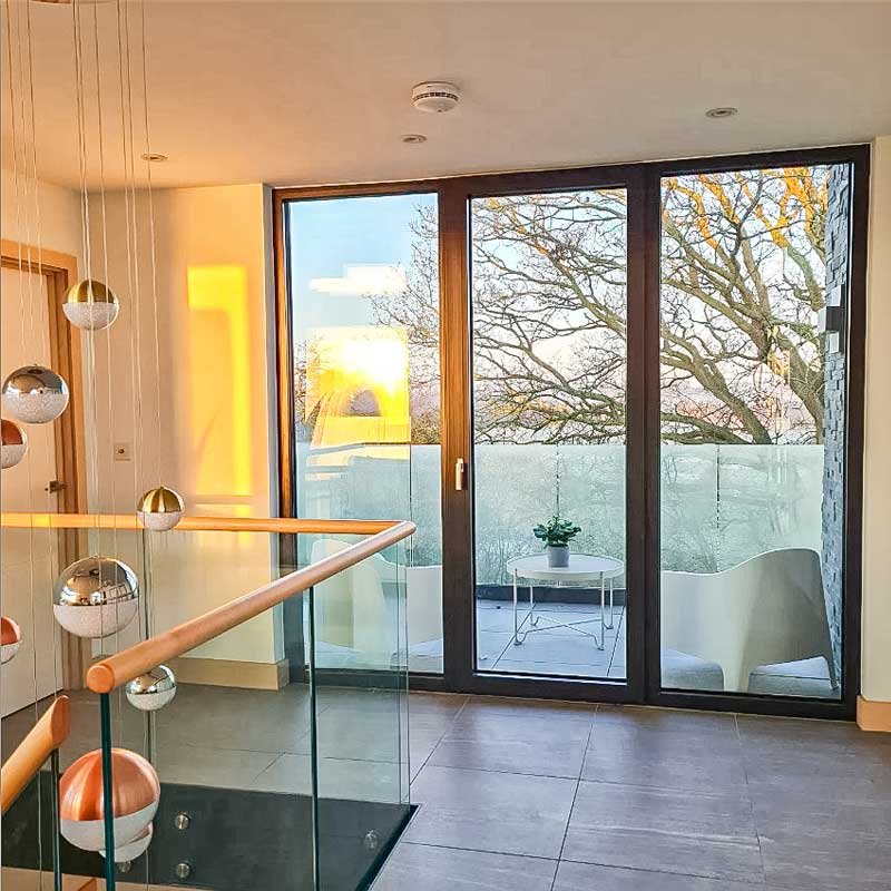 Landing-area-in-house-around-glass-balustrade