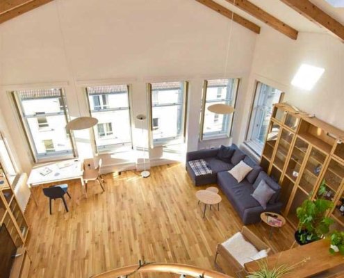 double-vaulted-ceiing-in-penthouse-with-oak-floor-and-spiral-stair