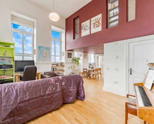 living-room-with-piano-and-oak-flooring