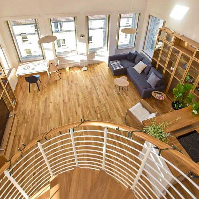 looking-down-a-spiral-stair-to-a-living-room