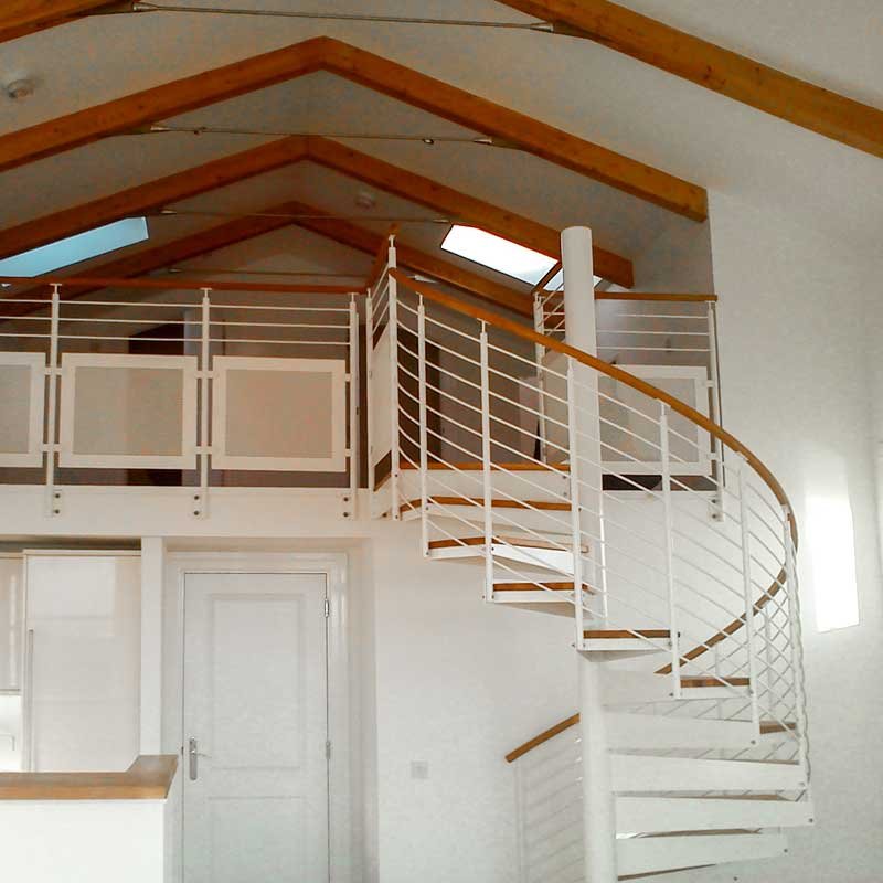 modern-steel-spiral-leading-to-deck-below-timber-rafters