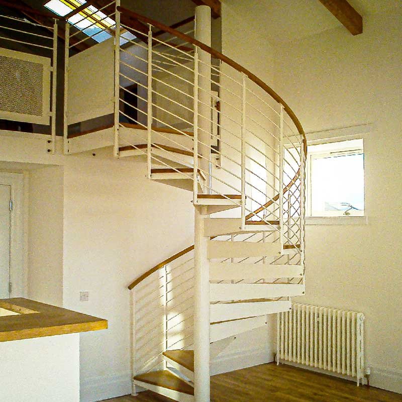 white-steel-spiral-with-oak-handrail-in-house